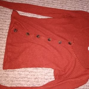 Reddish orange long sleeve shirt
